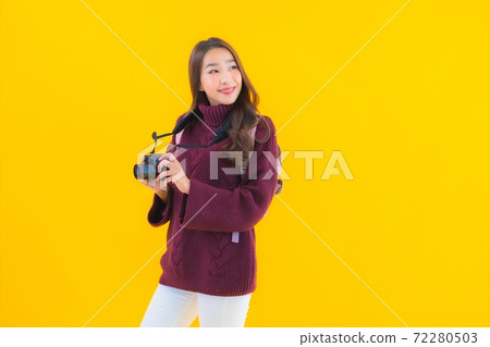 Portrait beautiful young asian woman with backpack and camera Portrait beautiful young asian woman with backpack and camera 72280503