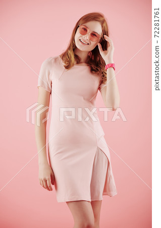 Cheerful young red haired woman 72281761