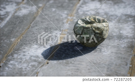 Old soccer ball the cement floor Old soccer ball the cement floor 72287205