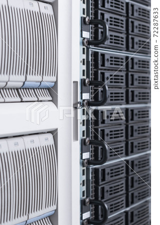 cluster of data storage SSD hard drives inside server rack 72287633