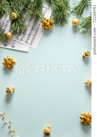 Empty blank for Christmas Carols and sings decorated golden balls on blue background. Empty blank for Christmas Carols and sings decorated golden balls on blue background. 72289761