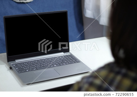 Image of a woman in remote work worcation in a camper Image of a woman in remote work worcation in a camper 72290655