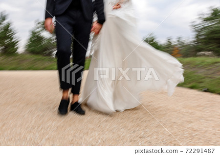 Brides walk on their wedding day, couple walk on their festive and touching day. 72291487