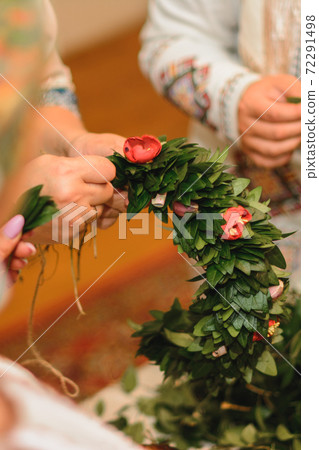 Wedding traditions in Ukraine, periwinkle wreath for the bride on her wedding day from her parents. 72291498