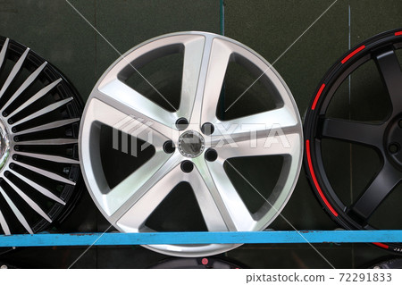Alloy Wheel of car on the shelf. Alloy wheels are wheels that are made from an alloy of aluminium 72291833