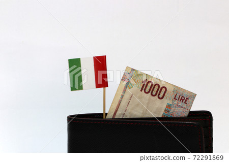 One thousand Lire of Italy banknote and mini Italia nation flag stick on the black wallet 72291869