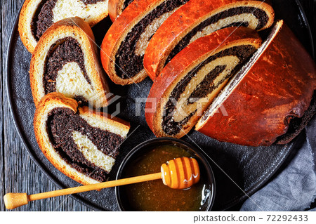 poppy seed strudel on a black platter 72292433