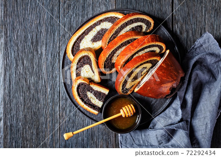 poppy seed strudel on a black platter 72292434