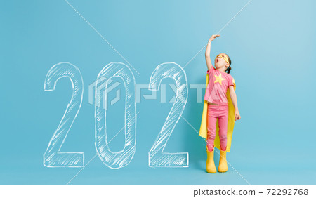 Child in superhero costume near 2021 Child in superhero costume near 2021 72292768