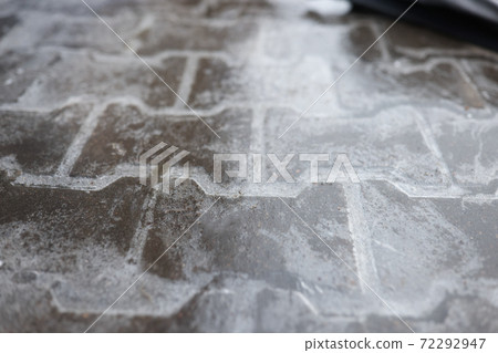 Road is covered with a thin layer of ice. Road is covered with a thin layer of ice. 72292947