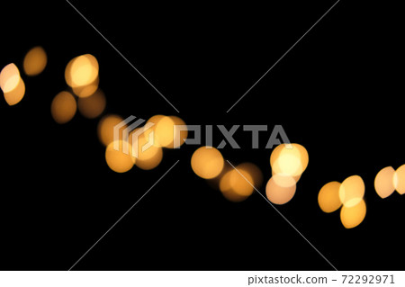 Blurred golden festive lights. Blurred garland backdrop for holidays and parties. Christmas Party concept 72292971
