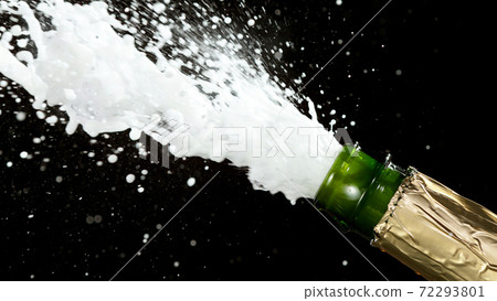 Detail of champagne wine splashing from bottle 72293801
