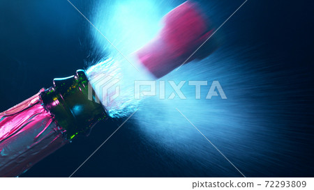 Detail of champagne wine splashing from bottle 72293809