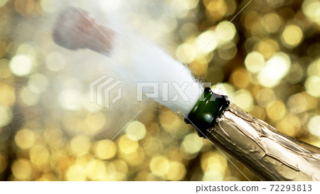 Detail of champagne wine splashing from bottle 72293813