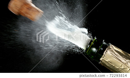 Detail of champagne wine splashing from bottle 72293814