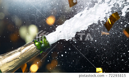 Detail of champagne wine splashing from bottle 72293815