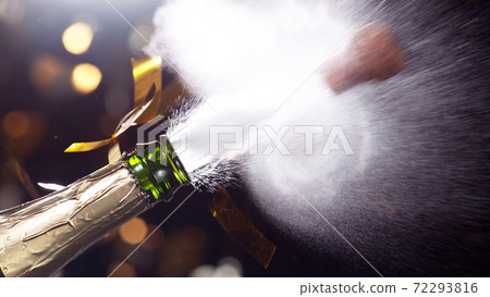 Detail of champagne wine splashing from bottle 72293816
