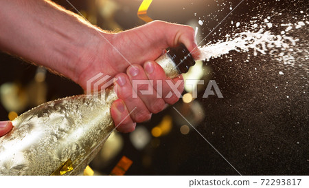 Champagne popping, detail of bottle with wine explosion Champagne popping, detail of bottle with wine explosion 72293817