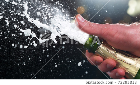 Champagne popping, detail of bottle with wine explosion 72293818