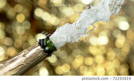 Detail of champagne wine splashing from bottle 72293819
