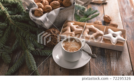 Food banner. Hot flavored nutty cappuccino with caramel and gingerbread Christmas cookies on a rustic table. Food banner. Hot flavored nutty cappuccino with caramel and gingerbread Christmas cookies on a rustic table. 72295326