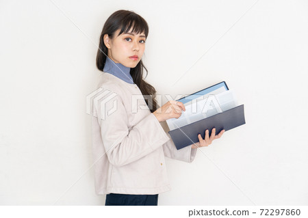 Businesswoman holding a file 72297860
