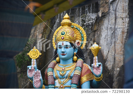 Batu Caves inside a limestone hill that has a series of caves and cave temples Batu Caves inside a limestone hill that has a series of caves and cave temples 72298130