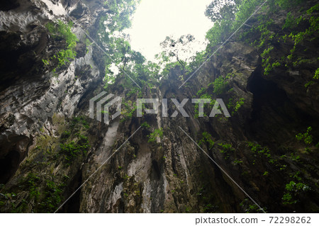 Batu Caves inside a limestone hill that has a series of caves and cave temples Batu Caves inside a limestone hill that has a series of caves and cave temples 72298262
