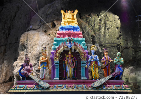 Batu Caves inside a limestone hill that has a series of caves and cave temples Batu Caves inside a limestone hill that has a series of caves and cave temples 72298275