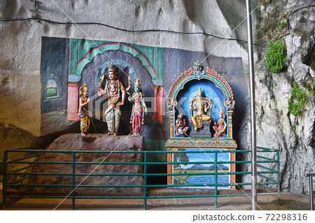 Batu Caves inside a limestone hill that has a series of caves and cave temples Batu Caves inside a limestone hill that has a series of caves and cave temples 72298316