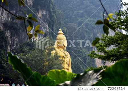Entrance to Batu Caves with the giant, golden Murugan statue and the 272-step colorful staircase Entrance to Batu Caves with the giant, golden Murugan statue and the 272-step colorful staircase 72298524