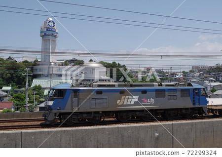 EF210 towed down freight train running with Akashi Astronomical Science Museum in the background EF210 towed down freight train running with Akashi Astronomical Science Museum in the background 72299324