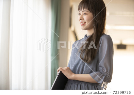 A woman with a personal computer A woman with a personal computer 72299756