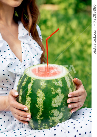 Watermelon with cocktail straw. 72299860