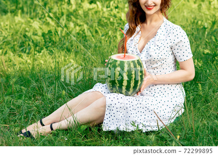 Watermelon with cocktail straw. 72299895