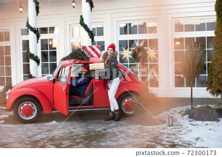 Young couple buys Christmas presents for their 72300173