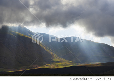 Dramatic mountain landscape near Castelluccio village in National Park Monte Sibillini, Umbria region, Italy Dramatic mountain landscape near Castelluccio village in National Park Monte Sibillini, Umbria region, Italy 72301064