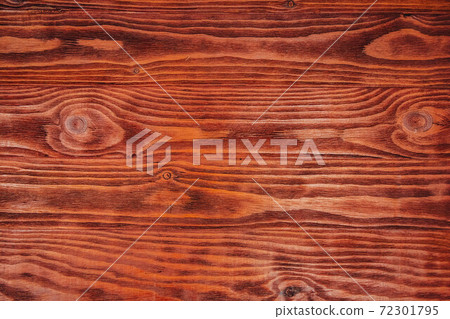 The structure of the mahogany surface as a background image. The creative concept of ecological nature. Background mahogany pattern 72301795