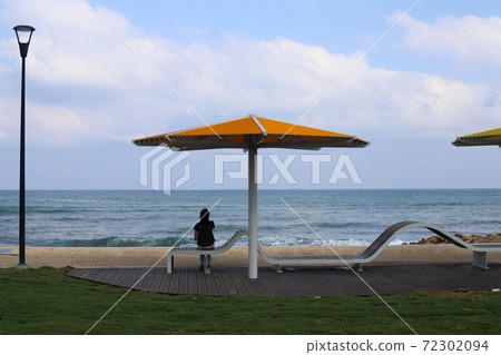 umbrella in a city park on the Mediterranean Sea in northern Israel	 72302094