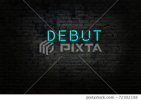 Night view of neon sign on brick wall 72302188