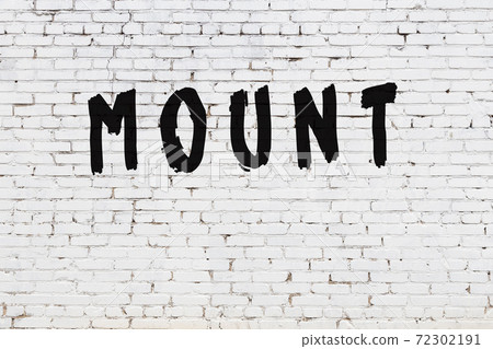 Word mount painted on white brick wall Word mount painted on white brick wall 72302191