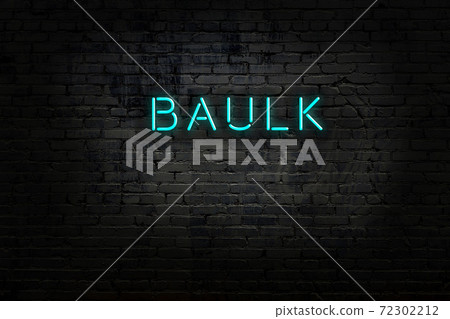 Night view of neon sign on brick wall 72302212