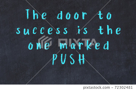 Chalk inscription of smart quote on black desk 72302481