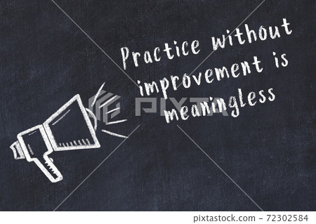 Chalk loudspeaker and wise quote on black desk Chalk loudspeaker and wise quote on black desk 72302584