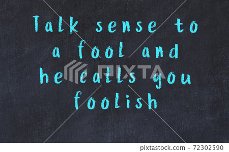 Chalk wise inscription on black chalkboard Chalk wise inscription on black chalkboard 72302590