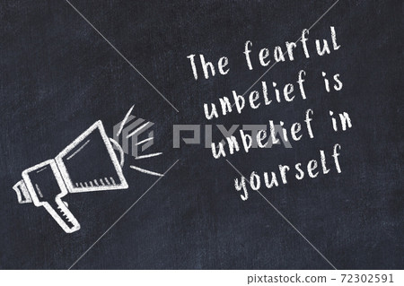 Chalk loudspeaker and wise quote on black desk Chalk loudspeaker and wise quote on black desk 72302591