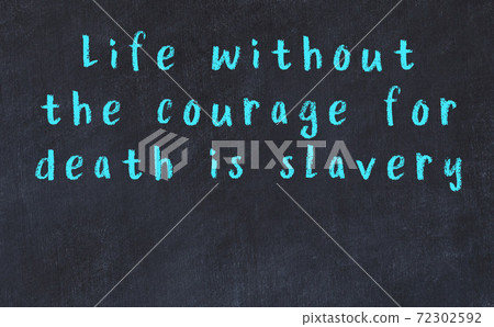 Black chalkboard with wise inscription on it Black chalkboard with wise inscription on it 72302592