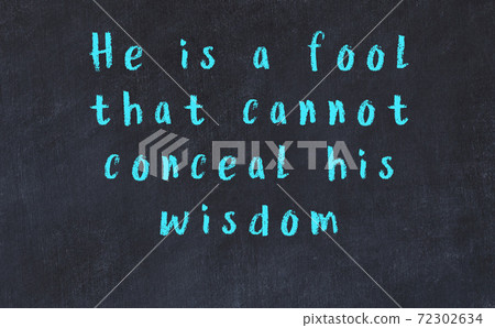 Chalk wise inscription on black chalkboard Chalk wise inscription on black chalkboard 72302634