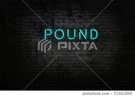 Night view of neon sign on brick wall Night view of neon sign on brick wall 72302809