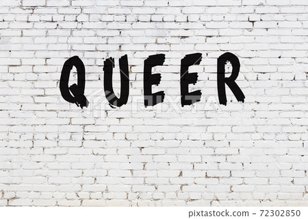 Word queer painted on white brick wall Word queer painted on white brick wall 72302850